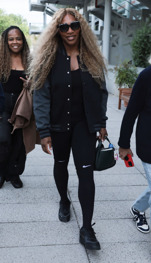 Isha Price and Serena Williams attend the men's singles tennis final at the 2024 Paris Olympics on Aug. 4, Nike, letterman jacket