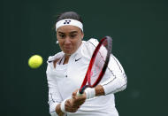 Ukraine's Anhelina Kalinina in action against Hungary's Anna Bondar during a women's singles first round match on day one of the Wimbledon tennis championships in London, Monday, June 27, 2022. (John Walton/PA via AP)