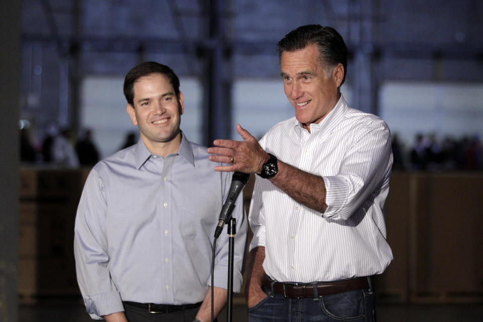 Republican presidential candidate, former Massachusetts Gov. Mitt Romney, accompanied by by Sen. Marco Rubio, R-Fla., talks to reporters in Aston, Pa., Monday, April 23, 2012. (AP Photo/Jae C. Hong)