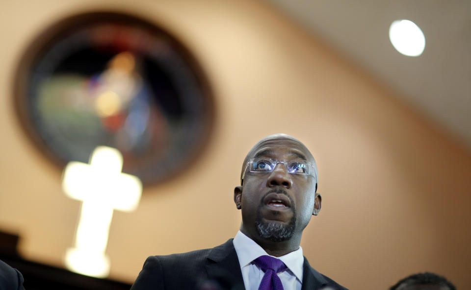 Rev. Raphael Warnock responds to President Donald Trump's comments about Haiti and Africa while speaking at Ebenezer Baptist Church on Jan. 12, 2018. Warnock and other faith leaders condemned Trump's "vile and racist" remarks made on the eve of the Martin Luther King Jr. holiday weekend. Warnock said it's hypocritical for Trump to sign a proclamation honoring King, given his comments. "A giant of a man does not need a proclamation from a small man like Donald Trump," he said. (Photo: David Goldman/Associated Press)