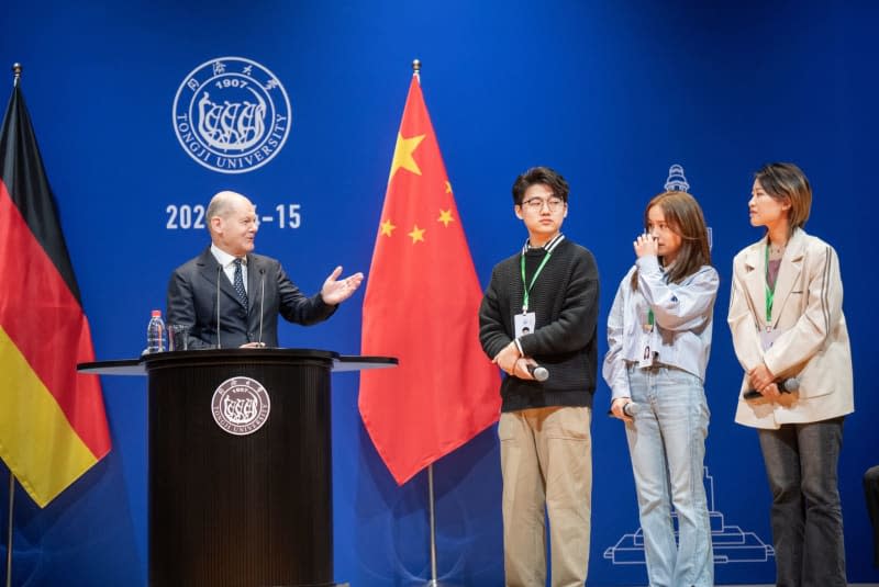 Germany's Chancellor Olaf Scholz (L) takes part in a town hall with students at Tongji University during his visit to Shanghai, as part of a three-day trip to China. Scholz is scheduled to meet China's President Xi Jinping in Beijing at the end of the trip. Michael Kappeler/dpa