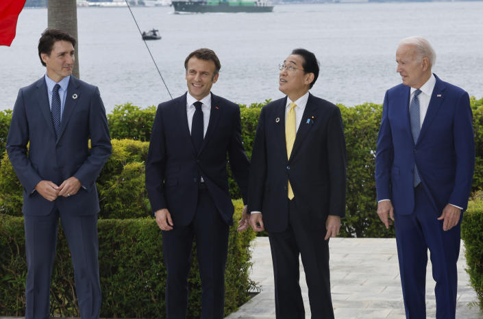 From left, Canada's Prime Minister Justin Trudeau, France's President Emmanuel Macron, Japan's Prime Minister Fumio Kishida and U.S. President Joe Biden participate in a family photo with G7 leaders before their working lunch meeting on economic security during the G7 summit, at the Grand Prince Hotel in Hiroshima, western Japan Saturday, May 20, 2023. (Jonathan Ernst/Pool Photo via AP)