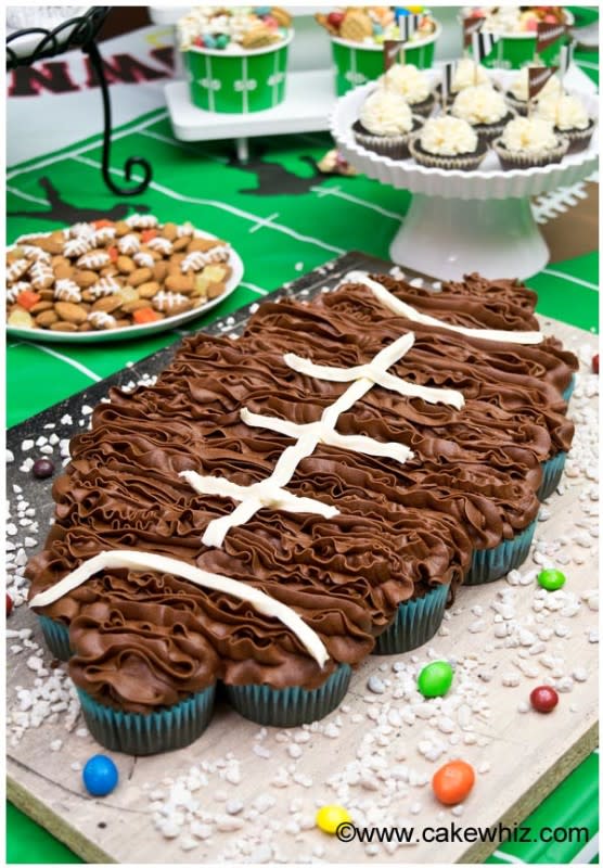 <p>Cake Whiz</p><p><strong>Get the recipe: </strong><a href="https://cakewhiz.com/football-pull-apart-cupcakes/" rel="nofollow noopener" target="_blank" data-ylk="slk:Football Pull-Apart Cupcakes;elm:context_link;itc:0;sec:content-canvas" class="link rapid-noclick-resp"><strong>Football Pull-Apart Cupcakes</strong></a></p>