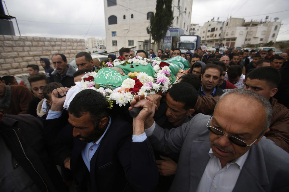 <p>Palestinians chant slogans as they carry the body of Abdel-Fattah al-Sharif, during his funeral, in the West Bank city of Hebron, May 28, 2016. Al-Sharif was killed by an Israeli soldier in March while lying on the ground seriously wounded after he and another Palestinian attacked IDF troops.(AP Photo/Nasser Shiyoukhi) </p>