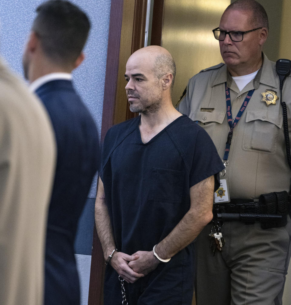 Outgoing Clark County Public Administrator Robert Telles is led into the courtroom during his arraignment at the Regional Justice Center, on Tuesday, Sept. 20, 2022, in Las Vegas. Telles is charged with murder in the death of Las Vegas Review-Journal investigative journalist Jeff German. (Bizuayehu Tesfaye/Las Vegas Review-Journal via AP)