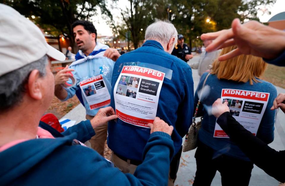 Before a rally and march for Israel in Moore Square in Raleigh on Nov. 7, 2023, attendees had posters taped to themselves of some of the people kidnapped when Hamas attacked Israel in October.
