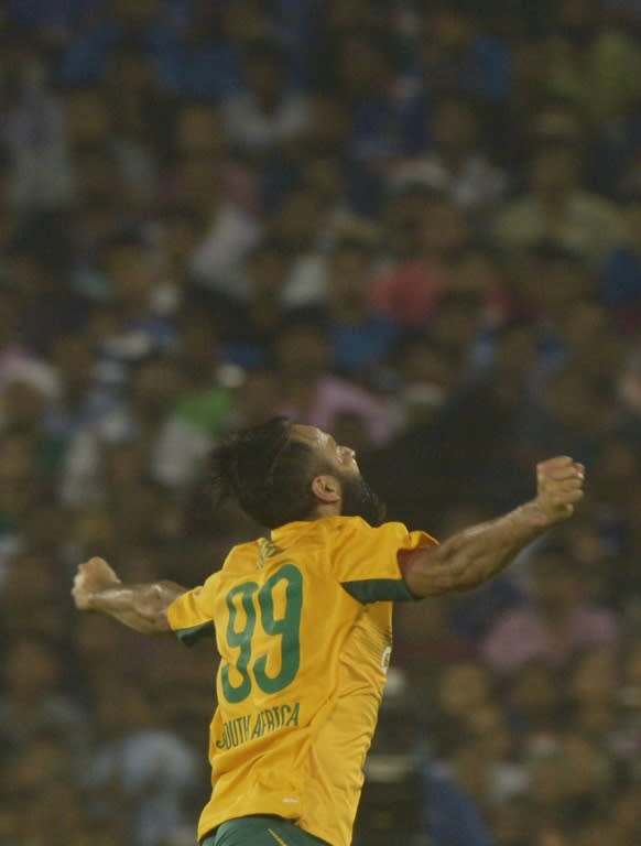 South Africa's Imran Tahir celebrates after taking the wicket of India's Harbhajan Singh during the second T20 at The Barabati Stadium in Cuttack on October 5, 2015