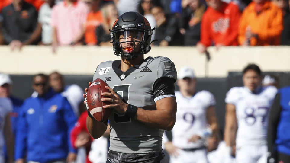 Oklahoma State quarterback Spencer Sanders (3) during an NCAA college football game against Kansas in Stillwater, Okla., Saturday, Nov. 16, 2019. (AP Photo/Sue Ogrocki)