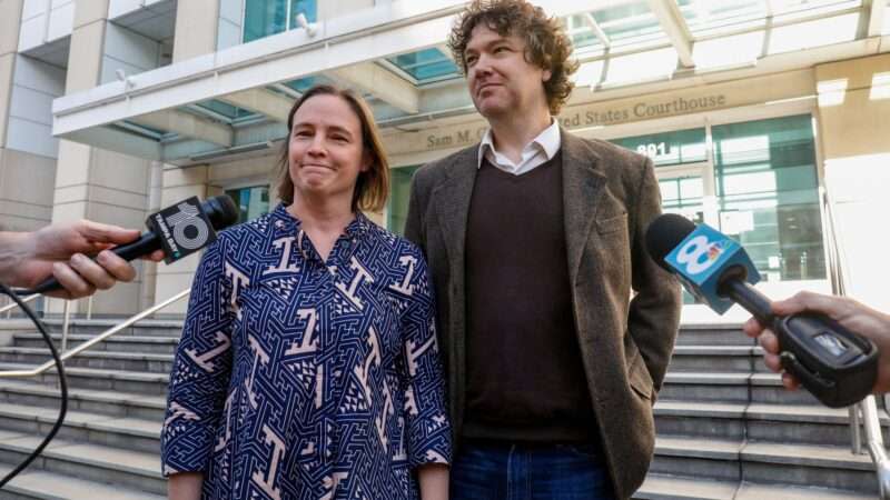 The journalist Tim Burke and his wife Lynn Hurtak address reporters on the front steps of the U.S. District Courthouse in Tampa, FL.