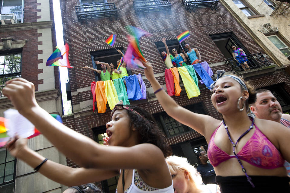 NEW YORK - JUNE 24: Revelers cheer during the New York City Gay Pride March on June 24, 2012 in New York City. The annual civil rights demonstration commemorates the Stonewall riots of 1969, which erupted after a police raid on a gay bar, the Stonewall Inn on Christopher Street. (Photo by Michael Nagle/Getty Images)