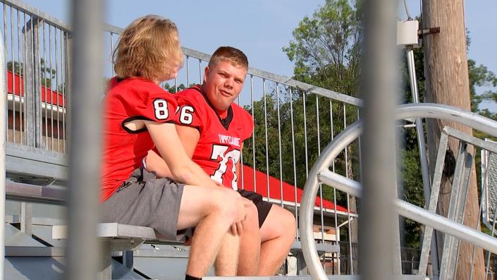 Gordan Haas (#76) sits in the new Tippecanoe student section after the bleachers were installed. Haas organized a fundraiser that raised enough money within hours for the new bleachers. (Mike Burianek/Staff)