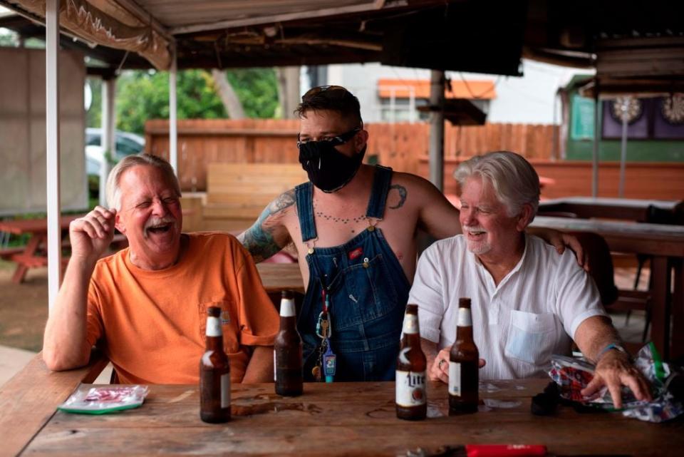 Last orders: Punters enjoy a beer last week before bars were ordered to close again - getty