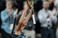 France's Diane Parry celebrates her win over Barbora Krejcikova of the Czech Republic in three sets, 1-6, 6-2, 6-3, during their first round match at the French Open tennis tournament in Roland Garros stadium in Paris, France, Monday, May 23, 2022. (AP Photo/Thibault Camus)