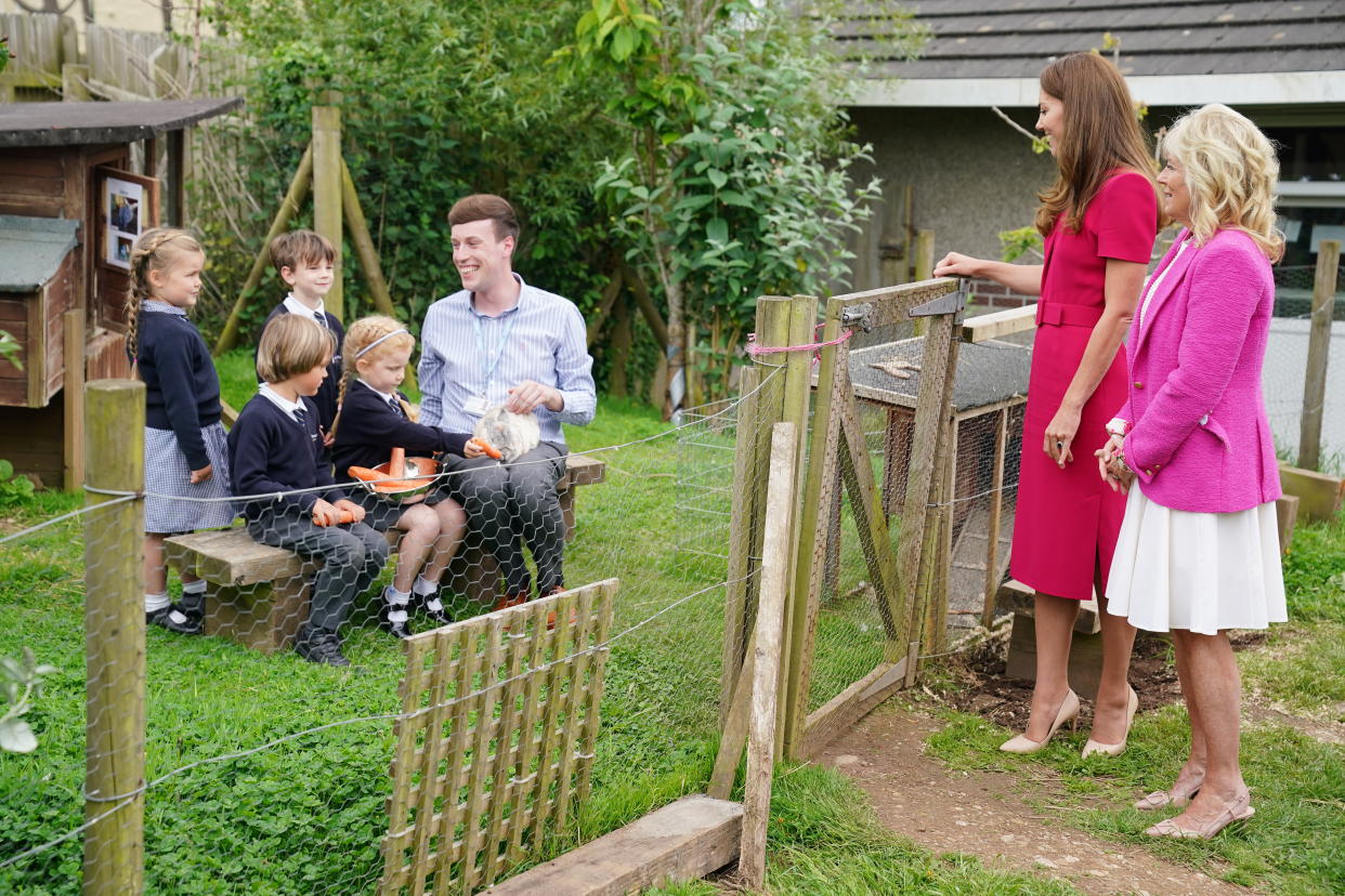 HAYLE, UNITED KINGDOM - JUNE 11: Catherine, Duchess of Cambridge and U.S. First Lady Dr Jill Biden (R) speak with the schools Reception Class and meet the school rabbit Storm, during a visit to Connor Downs Academy, during the G7 summit in Cornwall on June 11, 2021 in Hayle, west Cornwall, England. (Photo by Aaron Chown/WPA Pool/Getty Images)