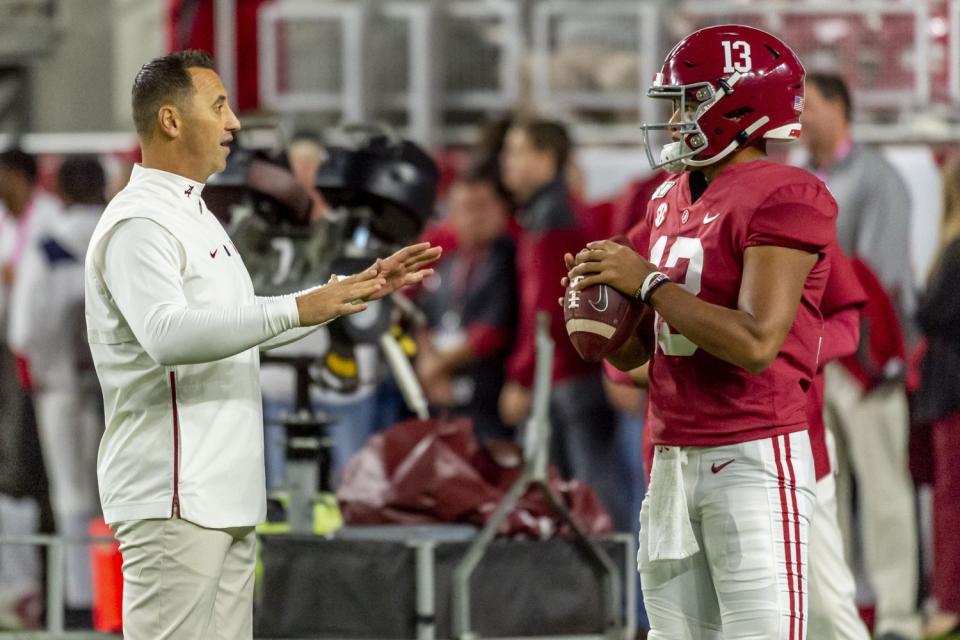 Alabama offensive coordinator Steve Sarkisian works with Crimson Tide quarterback Tua Tagovailoa