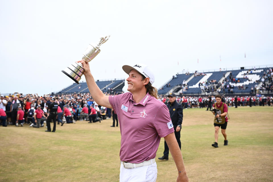 Seen here, Cameron Smith soaks in his British Open triumph by holding The Claret Jug aloft at the St Andrews Old Course. 