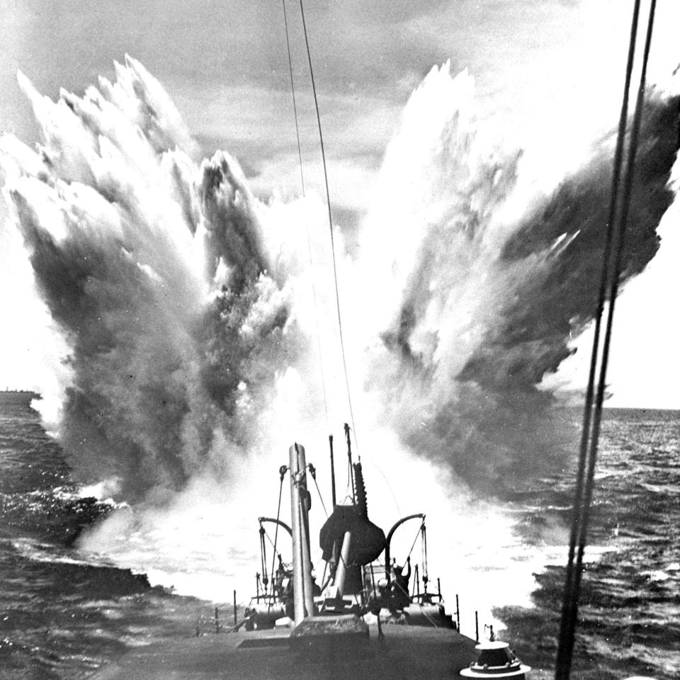 A British ship deploying a depth charge in 1943 - Alamy