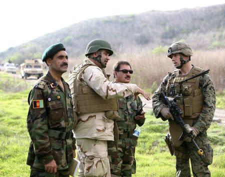 Afghan national army officers discuss lessons learned alongside Marines and Navy personnel while participating in combat scenario training exercises at U.S. Marine Corps Base Camp Pendleton in California, U.S. on January 14, 2010. Courtesy Christian M. Harding/U.S. Marines/Handout via REUTERS