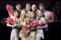 Spencer Howe, Brandon Frazier, Danny O'Shea, Daniel Tioumentsev, Sonia Baram, Ellie Kam, Alexa Knierim and Emily Chan, clockwise from top left, hold their medals after the pairs free skate at the U.S. figure skating championships in San Jose, Calif., Saturday, Jan. 28, 2023. Knierim and Frazier finished first, Howe and Chan finished second, Kam and O'Shea finished third, and Baram and Tioumentsev finished fourth in the event. (AP Photo/Tony Avelar)