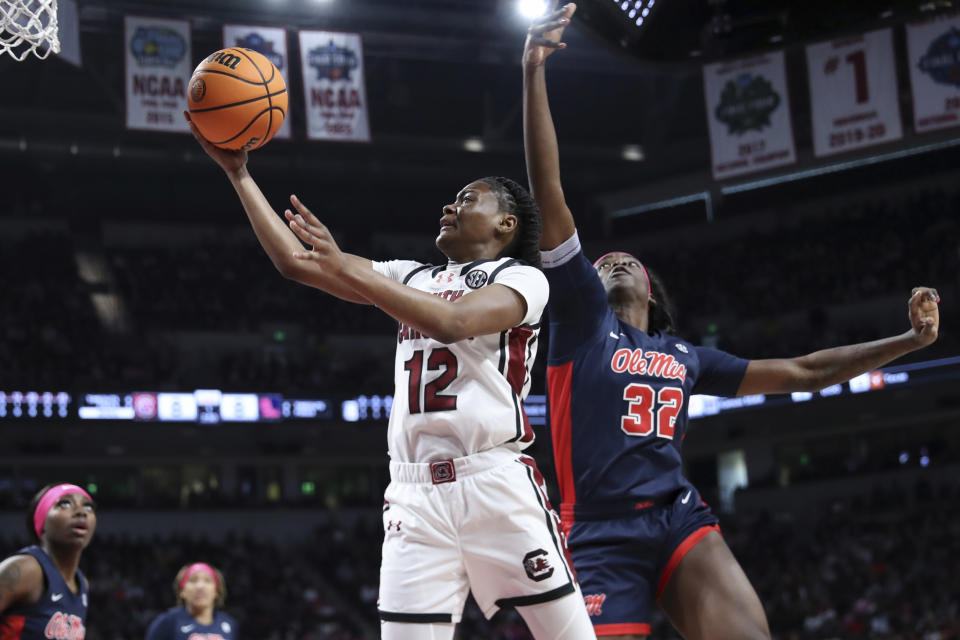 South Carolina guard MiLaysia Fulwiley (12) scores over Mississippi center Rita Igbokwe (32) during the first half of an NCAA college basketball game Sunday, Feb. 4, 2024, in Columbia, S.C. (AP Photo/Artie Walker Jr.)
