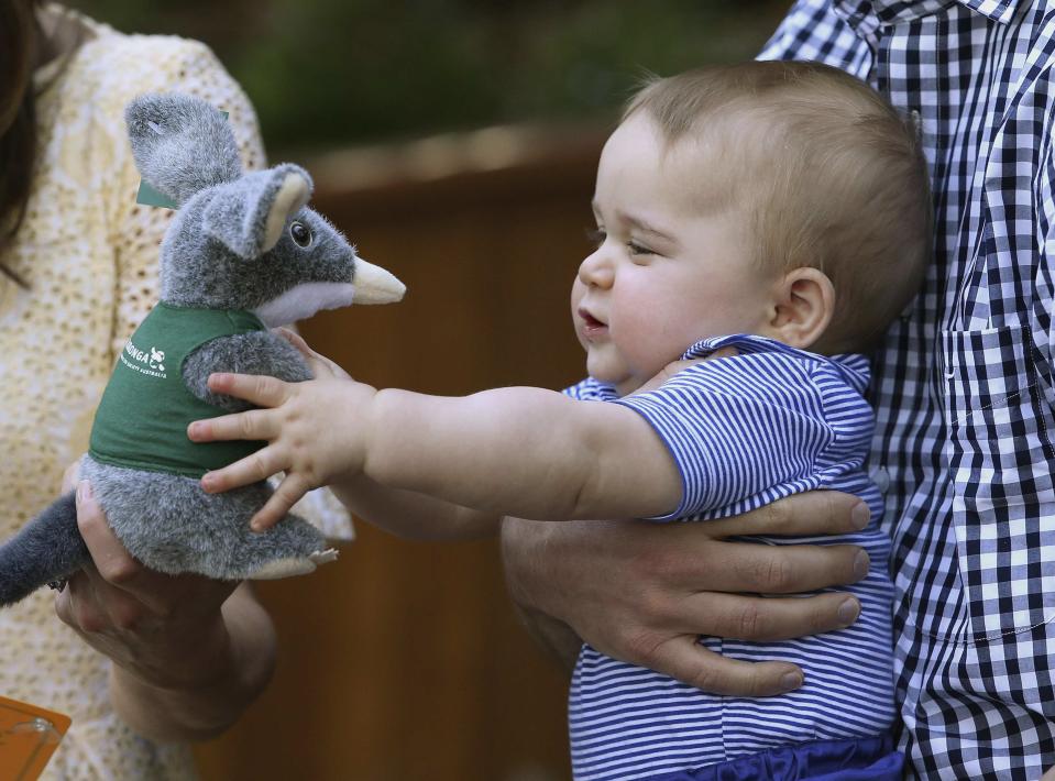 Britain's Prince George holds a toy Bilby during a visit to Taronga Zoo in Sydney, Australia April 20, 2014. Prince William and his wife Catherine, the Duchess of Cambridge, are on the second leg of a 19-day official visit to New Zealand and Australia with their son George. REUTERS/Chris Jackson/Pool (AUSTRALIA - Tags: ROYALS ANIMALS SOCIETY)