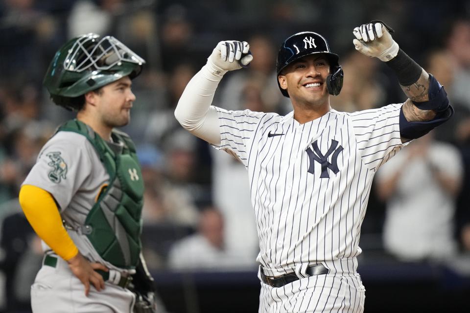 New York Yankees' Gleyber Torres celebrates after hitting a two-run home run, next to Oakland Athletics catcher Shea Langeliers during the fifth inning of a baseball game Tuesday, May 9, 2023, in New York. (AP Photo/Frank Franklin II)