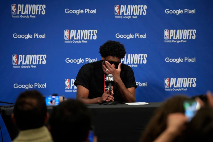 Philadelphia 76ers’ Joel Embiid adjusts his glasses while speaking at a news conference after Game 3 in an NBA basketball first-round playoff series against the New York Knicks, Thursday, April 25, 2024, in Philadelphia. (AP Photo/Matt Slocum)