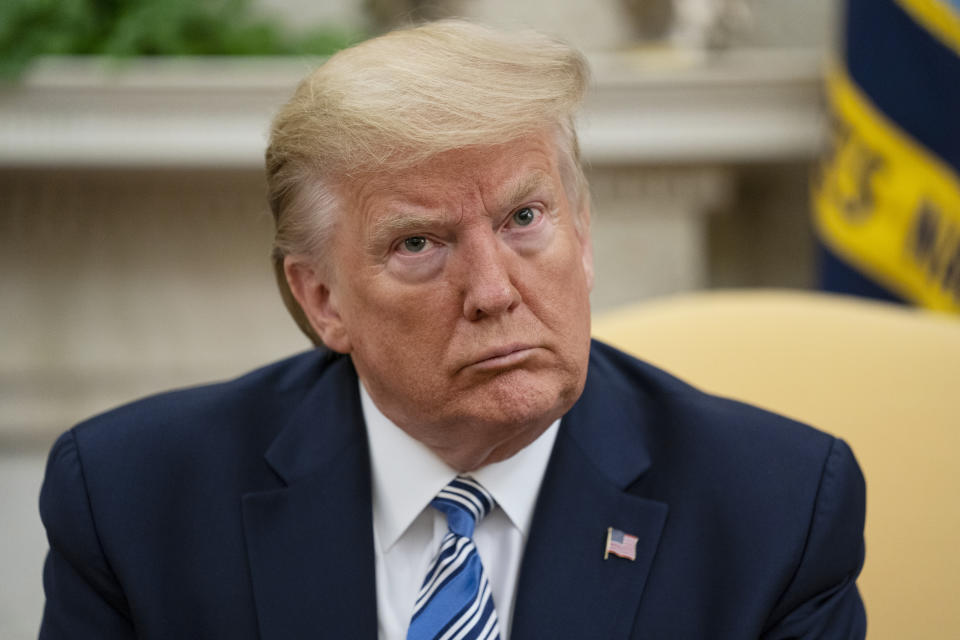 President Donald Trump listens during a meeting with Gov. Ron DeSantis, R-Fla., on the coronavirus response, in the Oval Office of the White House, Tuesday, April 28, 2020, in Washington. (AP Photo/Evan Vucci)