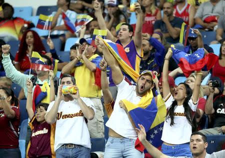 Aug 6, 2016; Rio de Janeiro, Brazil; Venezuela fans cheer in the men's basketball group A preliminary round during the Rio 2016 Summer Olympic Games at Carioca Arena 1. Mandatory Credit: Jeff Swinger-USA TODAY Sports/Files