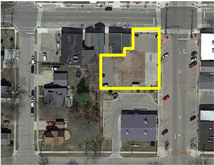 An aerial view of the site for a proposed three-story, mixed-use building in downtown DeWitt.