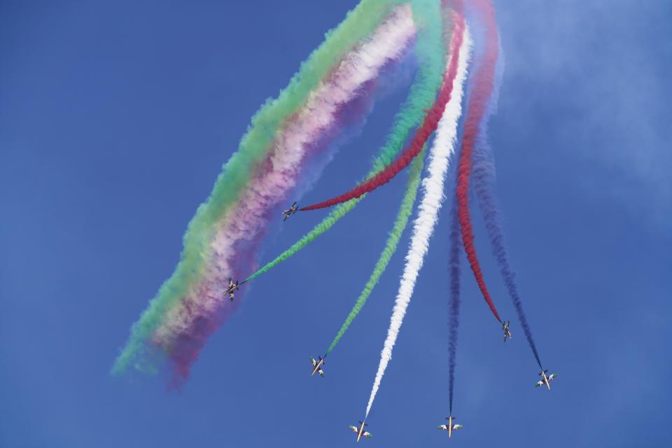 Al Fursan, the United Arab Emirates Air Force's aerobatic team, performs at the Dubai Air Show in Dubai, United Arab Emirates, Wednesday, Nov. 17, 2021. (AP Photo/Jon Gambrell)