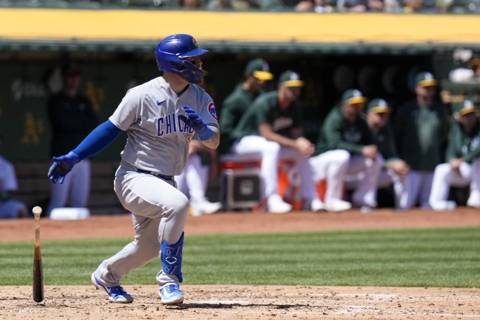 Chicago Cubs' Tucker Barnhart watches his sacrifice fly against the Oakland Athletics during the fifth inning of a baseball game in Oakland, Calif., Wednesday, April 19, 2023. (AP Photo/Godofredo A. Vásquez)