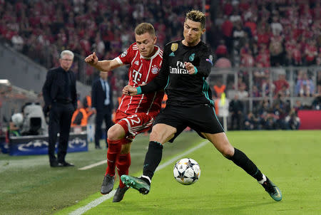 Soccer Football - Champions League Semi Final First Leg - Bayern Munich vs Real Madrid - Allianz Arena, Munich, Germany - April 25, 2018 Bayern Munich's Joshua Kimmich in action with Real Madrid's Cristiano Ronaldo REUTERS/Thorsten Wagner