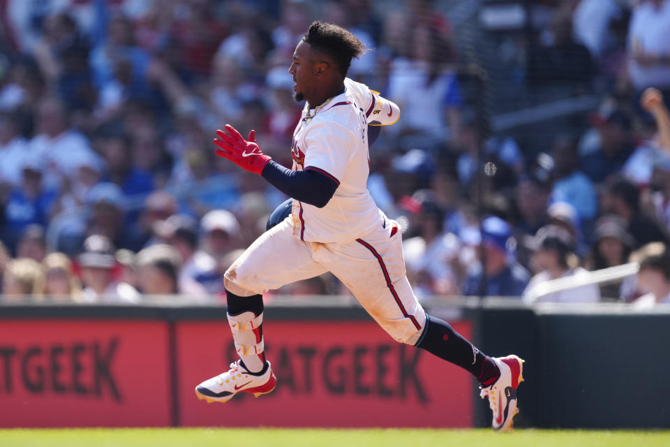 Atlanta Braves' Ozzie Albies (1) runs to second base after hitting a double in the eighth inning of a baseball game against the Arizona Diamondbacks Sunday, April 7, 2024, in Atlanta. (AP Photo/John Bazemore)