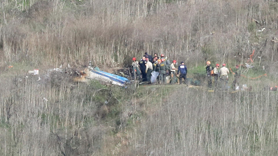 Emergency personnel, pictured here working at the crash site where Kobe Bryant died.