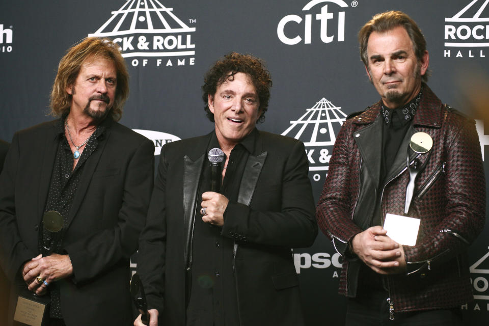 Gregg Rolie, from left, Neal Schon and Jonathan Cain of the band Journey pose in the press room at the 2017 Rock and Roll Hall of Fame induction ceremony at the Barclays Center on Friday, April 7, 2017, in New York. (Photo by Andy Kropa/Invision/AP)