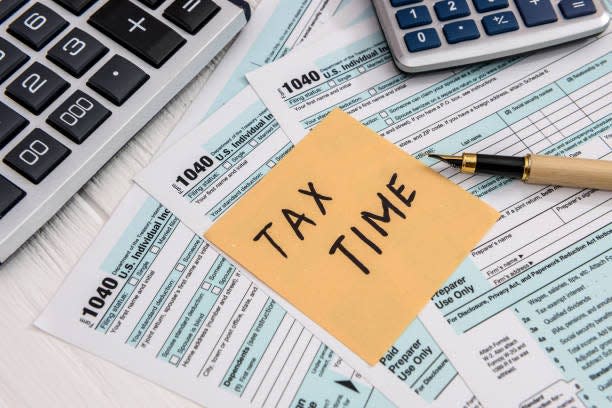 'Tax time' memo on 1040 individual tax form.