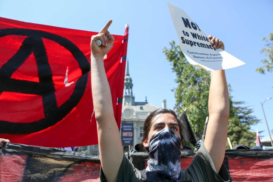 Antifa members and counter protesters gather during a rightwing No-To-Marxism rally on August 27, 2017 at Martin Luther King Jr. Park in Berkeley, California: Getty