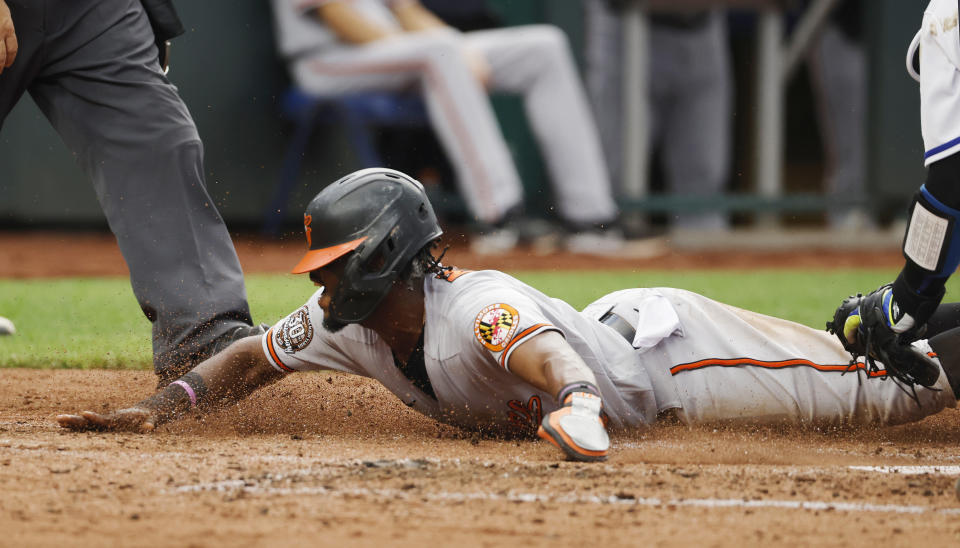 Baltimore Orioles' Jorge Mateo scores from third on a grounder by Trey Mancini during the third inning of a baseball game against the Kansas City Royals in Kansas City, Mo., Thursday, June 9, 2022. (AP Photo/Colin E. Braley)