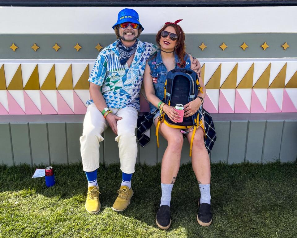 Edd and Molly Benda sitting at Coachella.