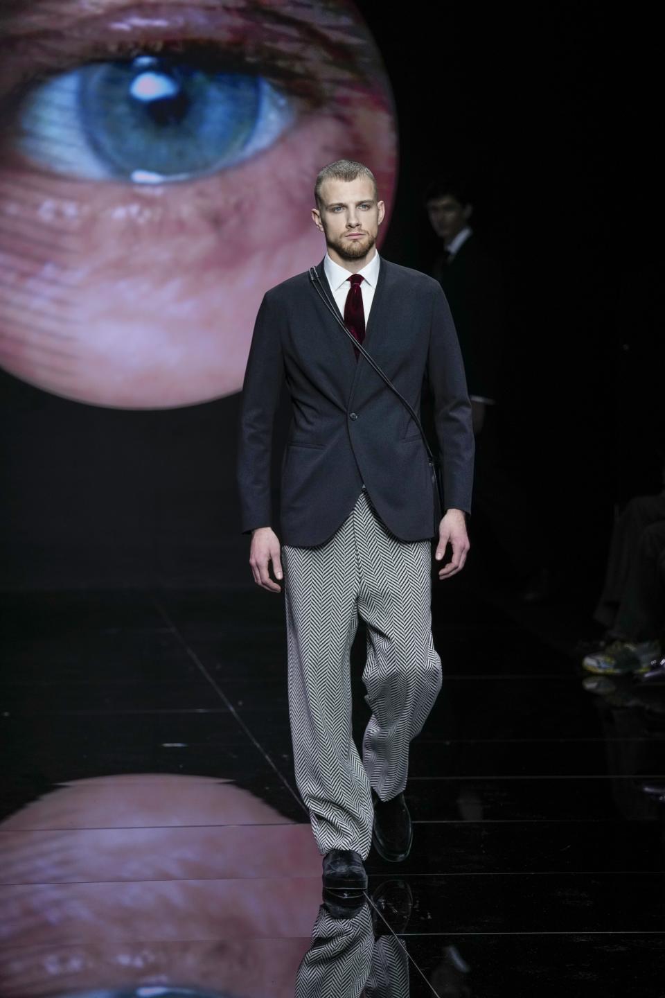 A model wears a creation part of the men's Giorgio Armani Fall-Winter 2024-2025 collection, that was presented in Milan, Italy, Sunday, Jan. 14, 2024. (AP Photo/Antonio Calanni).