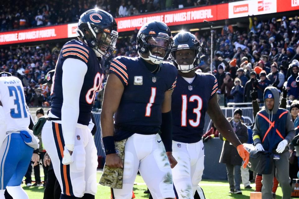 Chicago Bears quarterback Justin Fields (1) celebrates after scoring a touchdown against the Detroit Lions late in the first half at Soldier Field, Nov. 13, 2022.