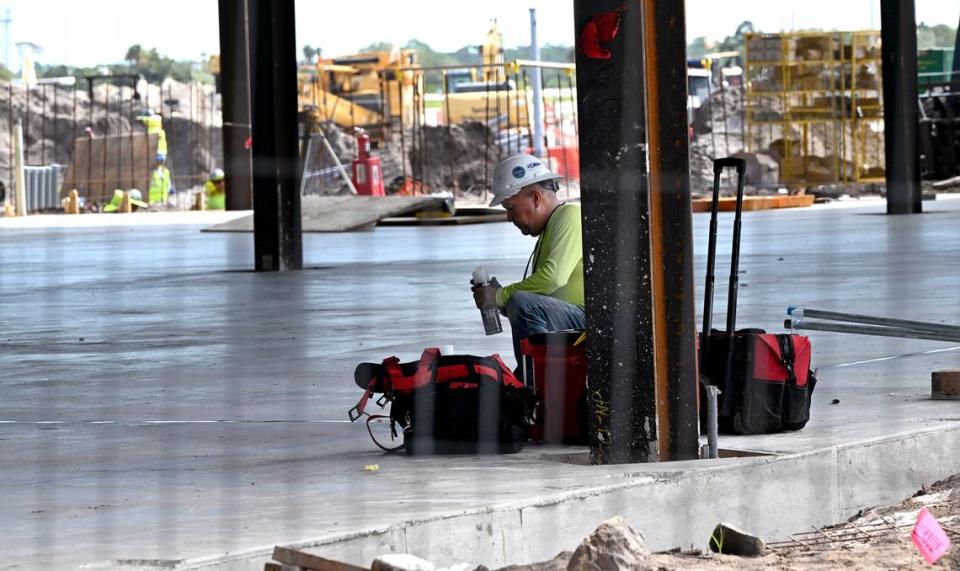 A construction worker in the new terminal under construction at Sarasota Bradenton International Airport, Sept. 25, 2023.