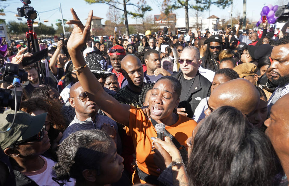 LaPorsha Washington, center, the mother of seven-year-old daughter Jazmine Barnes, who was killed on Sunday, speaks to the crowd during a community rally outside Walmart, Saturday, Jan. 5, 2019, in Houston. Jazmine was shot to death nearby on Sunday while riding in a car with her mother and three sisters. (Melissa Phillip/Houston Chronicle via AP)