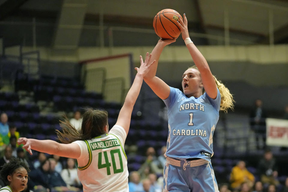 North Carolina guard Alyssa Ustby (1) shoots as Oregon forward Grace VanSlooten (40) defends during the first half of an NCAA college basketball game in the Phil Knight Invitational tournament Thursday, Nov. 24, 2022, in Portland, Ore. (AP Photo/Rick Bowmer)