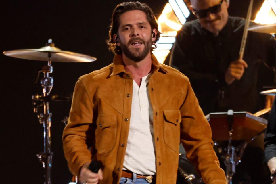 <p>Jason Kempin/Getty</p> Thomas Rhett performs at the ACM Awards in Frisco, Texas on May 16, 2024