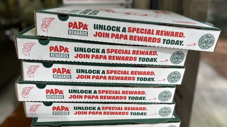 Papa Johns' pizza boxes stacked