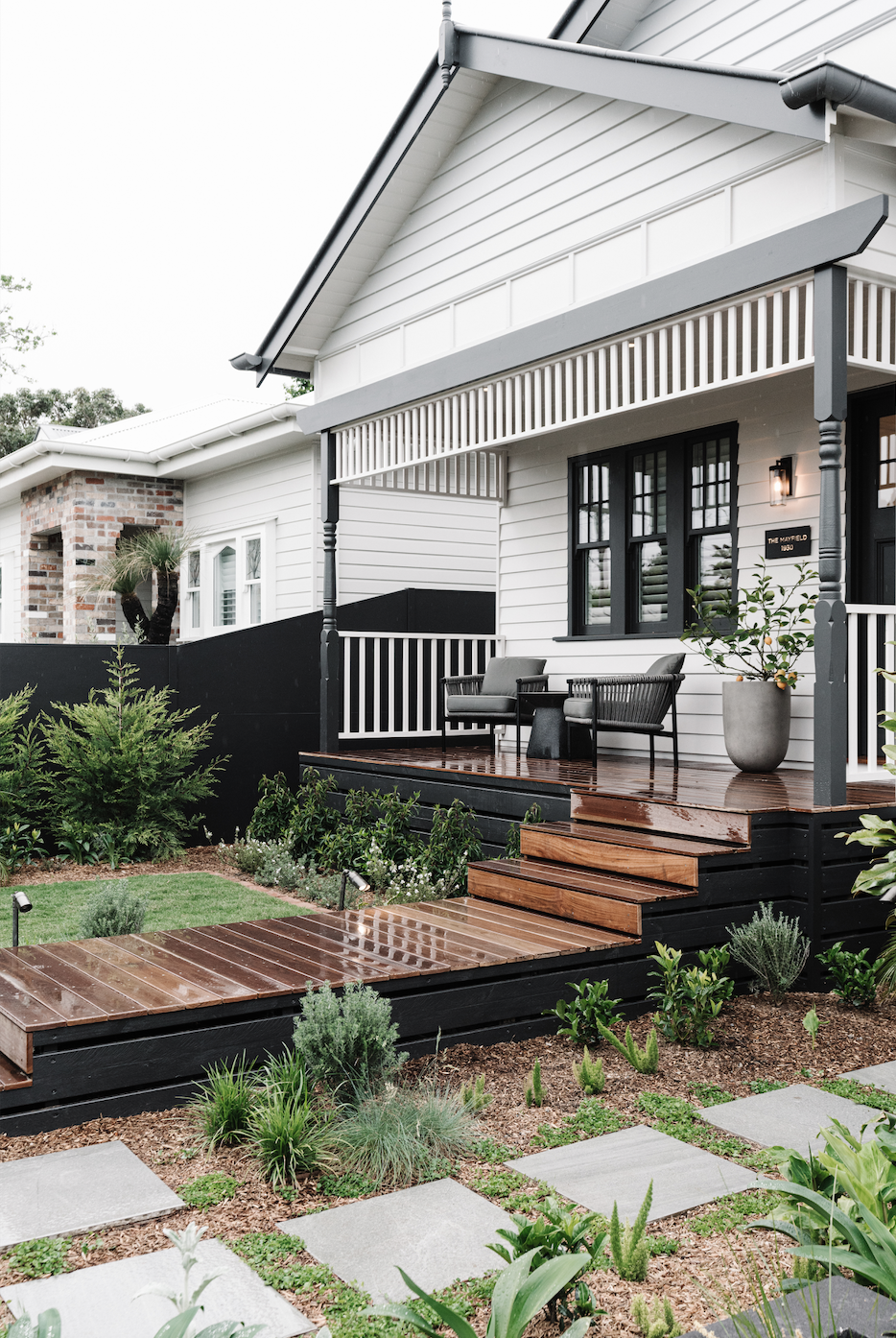 a house with a patio and a large front yard