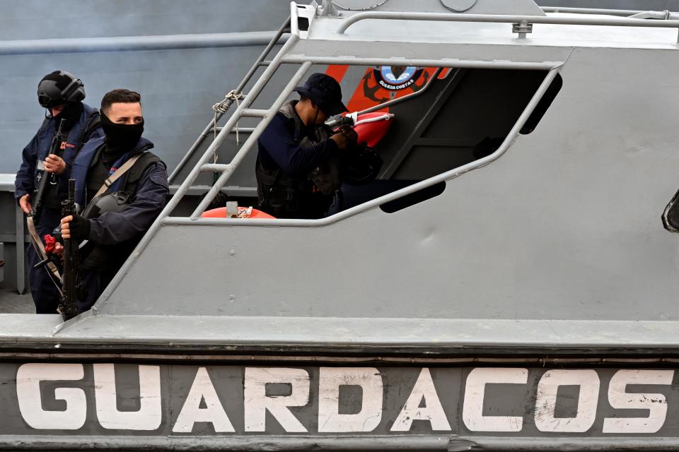 Members of the Coast Guard Command (COGUAR) of the Ecuadorian Navy prepares to go on a patrol along tributary channels of the Guayas River next to port terminals while participating in an anti-drug trafficking patrol in Guayaquil, Ecuador on January 14, 2024.  / Credit: YURI CORTEZ/AFP via Getty Images