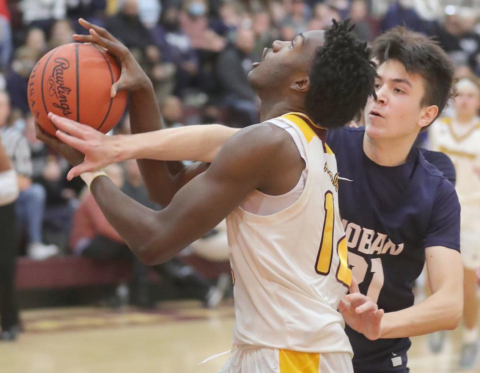 Hoban's Andrew Griffith fouls Walsh Jesuit's Keith Rivers during the 3rd quarter on Tuesday, Jan. 25, 2022 in Cuyahoga Falls.